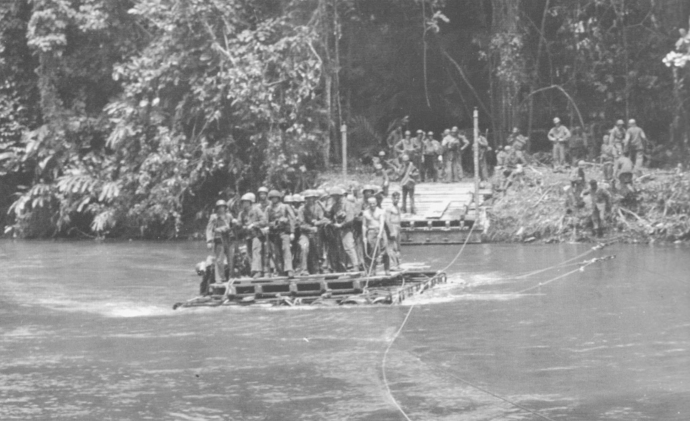 U.S. Marines cross the Matanikau River on Guadalcanal on a raft ferry. 